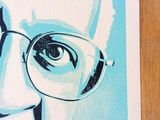 a drawing of a man with glasses on a table