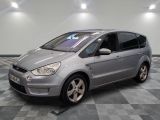 a picture of a silver car parked on a checkered floor