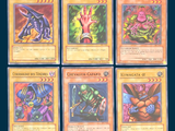 four different pokemon cards of different colors and designs