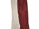 two pairs of red and white pants sitting next to each other