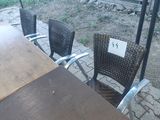 a table and chairs that are outside on the patio