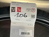 a close up of a tire with a sticker on it