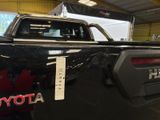 a picture of a toyota pickup truck parked in a garage