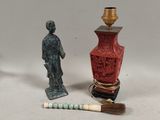 two miniature figurines that are sitting next to each other