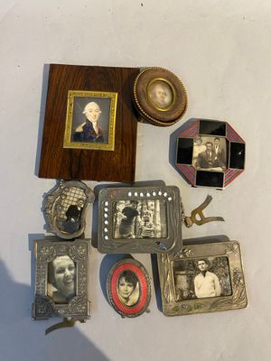 a lot of antique items on a white table