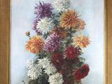 une photo d'un tableau de fleurs dans un cadre doré