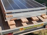 a trailer with a solar panel on the back of it