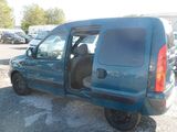 a blue van that is parked in a parking lot
