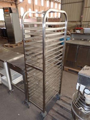 an image of a kitchen with a metal rack and a fan