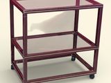 a glass table with a metal frame on wheels