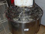 an image of a mixer in a kitchen with a red wall