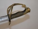 a close up of a sword with a metal handle