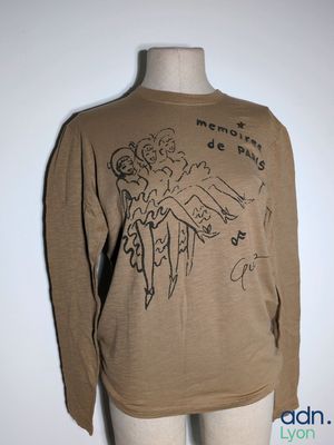 long sleeved t - shirt with a drawing of a woman ' s face on it