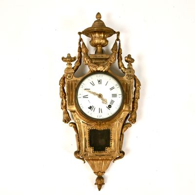 a clock that is hanging on the wall on the wall