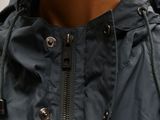 the back of a jacket with a hood and zippers on a mannequin mannequin mannequin mannequin mannequin mannequin mann