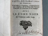 an open book with a black and white image of flowers on it