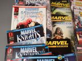 a lot of comic books sitting on a table