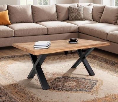 a coffee table with a book on it in a living room