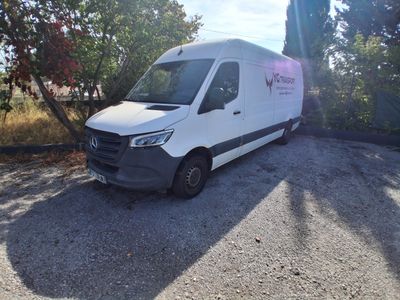 a white van that is parked on the side of the road