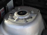 a close up of a car ' s engine with a gas tank