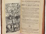 an open book with a picture of a man on horseback in the middle of it