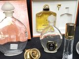 a lot of perfume bottles and a perfume bottle on a table