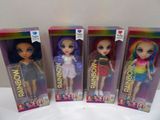 three dolls of different colors are in a row on a table