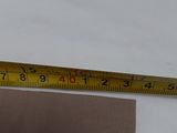 a measuring tape that is on top of a piece of fabric