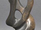 abstract sculpture of a woman ' s face on a marble base