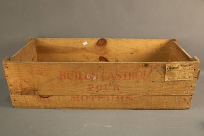 an old wooden box with a label on it sitting on top of a table