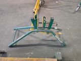 a green and yellow bike rack on the ground