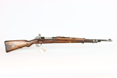 a rifle with a wooden barrel on a white background