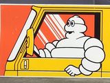 tableau représentant un homme au volant d'un camion dont l'arrière est équipé d'un écran de télévision