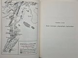 an open book with a map in it on a table