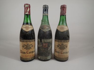 three bottles of wine sitting next to each other on a table