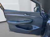 the door of a car with the driver ' s side door open