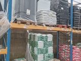 many stacks of items on the shelves in the warehouse