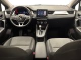 the interior of a car with a steering wheel, dashboard, and dashboard controls