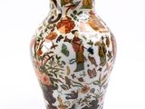 a vase with a floral design on it on a white background