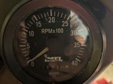 a close up of a speedometer on a motorcycle