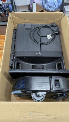 a cardboard box with a television in it sitting on a table