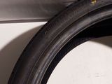 a close up of a tire tire on a white surface