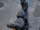 a motorcycle that is parked on the side of the street