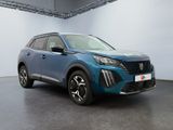 the blue suv is parked in a large room with a white wall