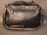 an image of a black leather purse with a strap