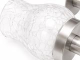 a pair of glass toothbrush holders on a white surface