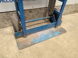 an image of a blue hand truck with wheels on it