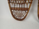 a pair of snowshoes hanging on the wall