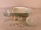 a lot of glassware sitting on a table next to a box