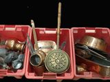 a red container filled with different types of metal items